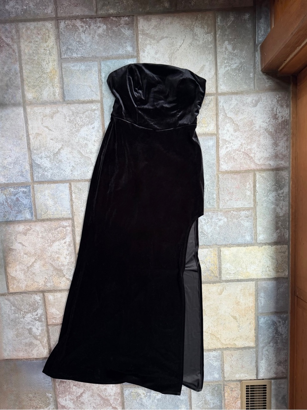 Strapless black velvet maxi dress with leg slit